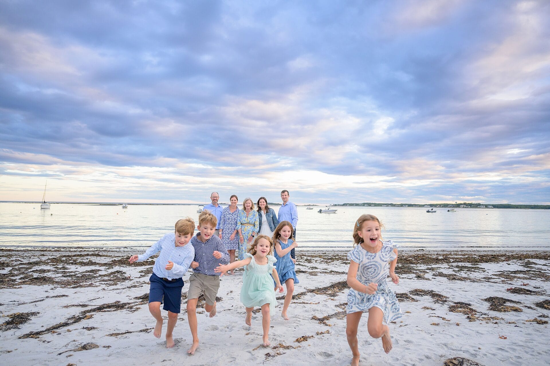 candid and fun family portraits at goose rocks beach in kennebunkport maine 