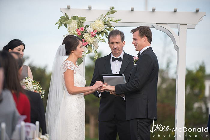 wedding at the westmoor club in nantucket massachusetts with wedding photographer brea mcdonald of brea mcdonald photography outdoor ceremony country club reception floral design by soiree floral beach portraits couple portraits new england coastal weddings